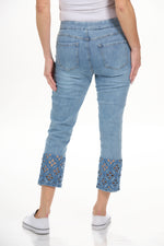 Back view pull on crop jean with embroidered and cutout hem