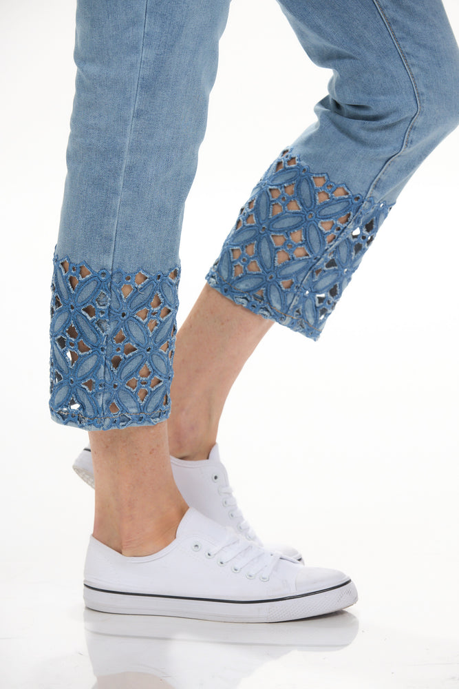 Close up view pull on crop jean with embroidered and cutout hem