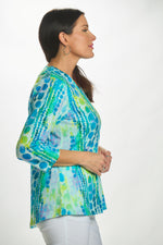 Side view 3/4 sleeve v-neck top in blue/green circle print