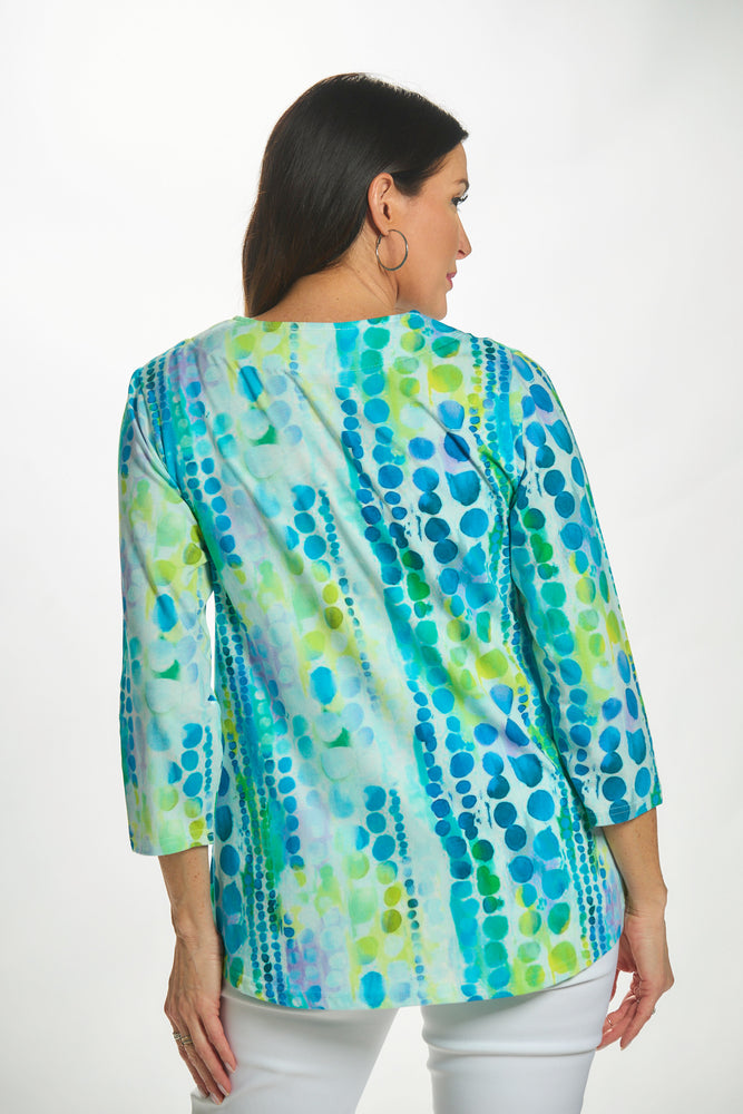 Back view 3/4 sleeve v-neck top in blue/green circle print
