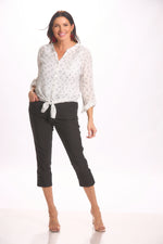 Full front image of button up white blouse with red heart print