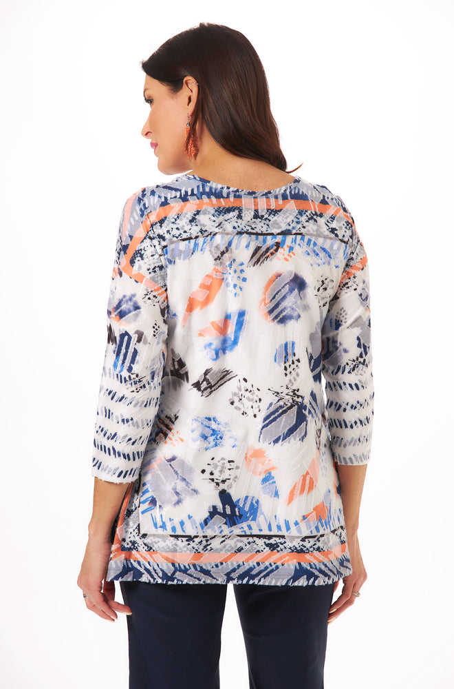 image of short sleeve tie top with blue and orange print