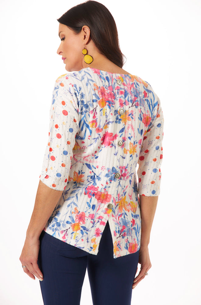 back view of floral 3/4 sleeve top with button back