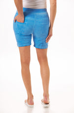 back view of blue crinkle tie pull on shorts