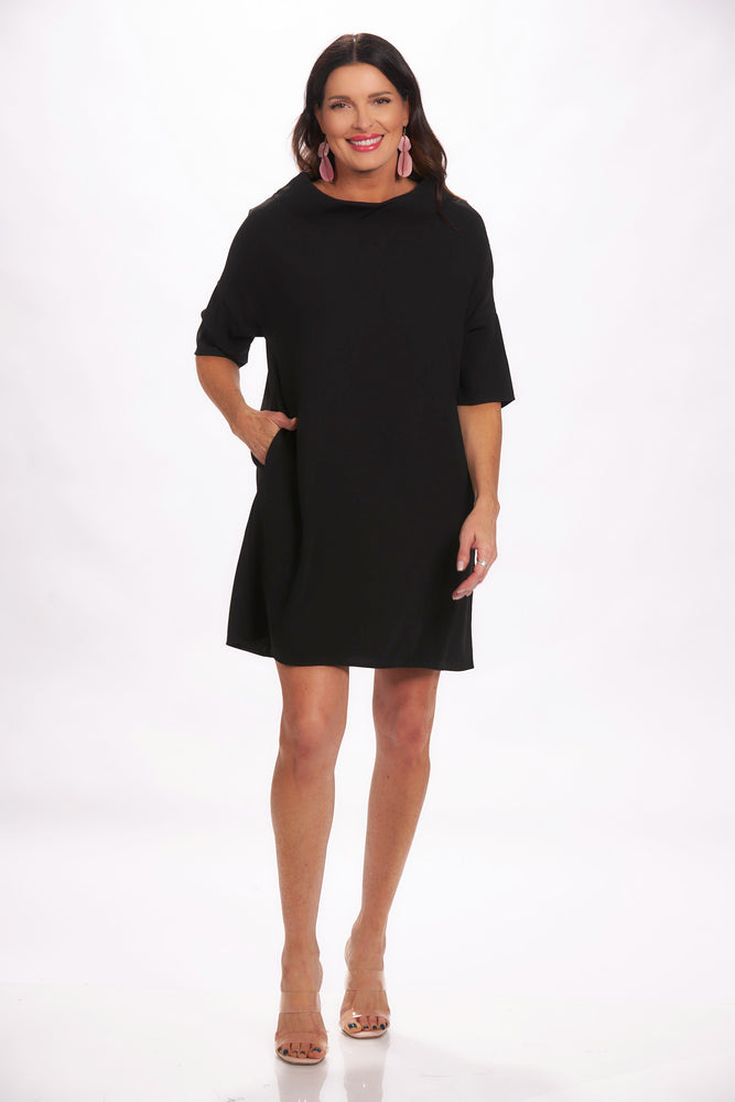 Full front view black shift dress with cowl neck and hidden pockets