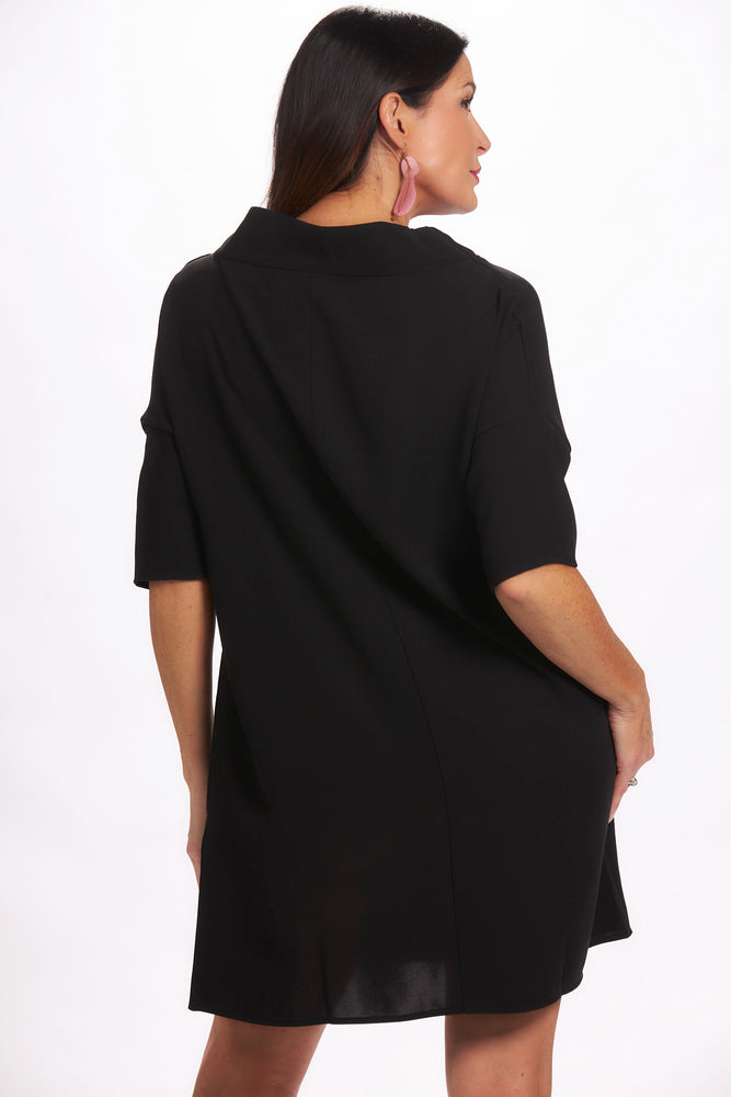 Back view black shift dress with cowl neck and hidden pockets