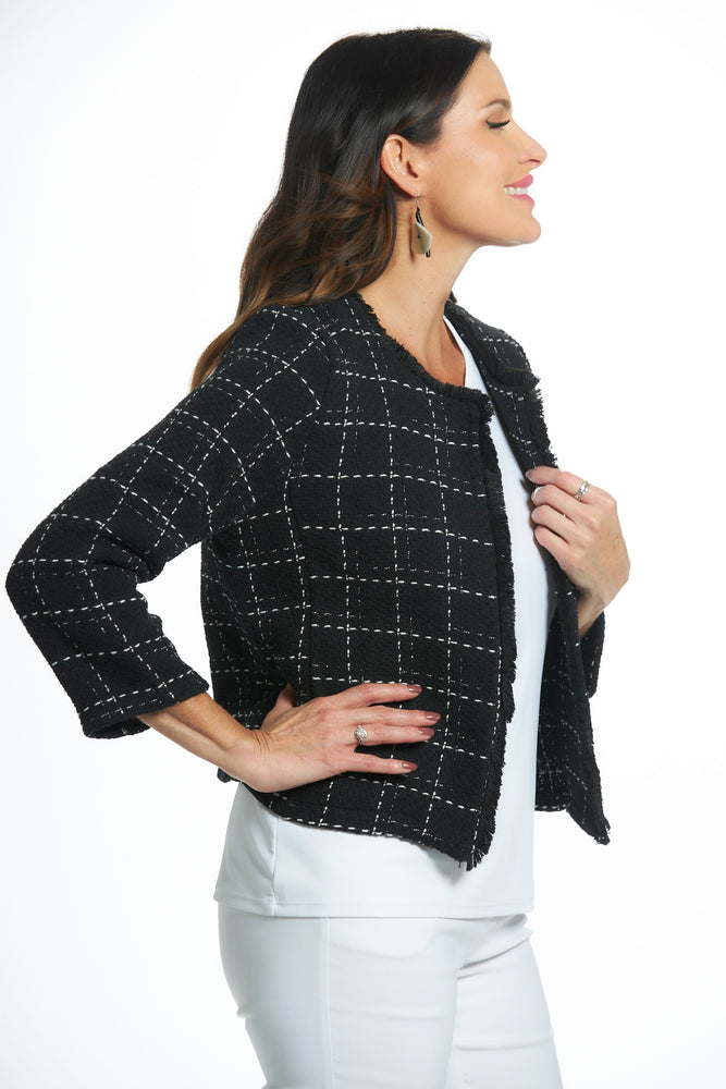 Side view black and white long sleeve boucle jacket