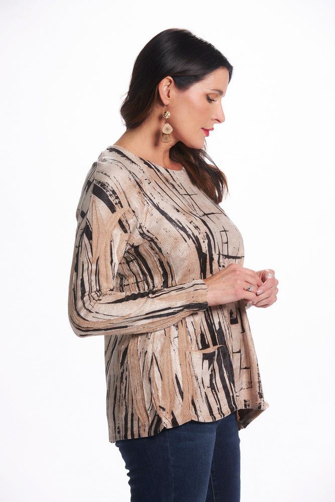 Side image of impulse long sleeve tunic with pockets in spackle lines print. Long sleeve top. 