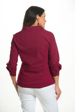 Back image of spiced verry ribbed knit top. 