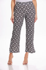 Front image of Mimozza pull on side slit ankle pants. Black and white feather printed pants. 