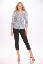 Front image of impluse top. Black and white faux printed top. 