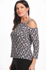 Side image of Mimozza one shoulder top. Black and white feather printed top. 