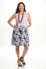 Front image of Shana sleeveless crinkle dress with pockets. Black and white floral print. 