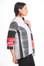 Side image of parsley&sage 3/4 sleeve flare shirt. Black white and red geo printed top. 