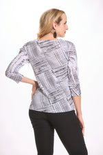 Back image of impluse top. Black and white faux printed top. 