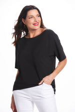 Front image of Black mimozza short sleeve dolman sleeve top. 