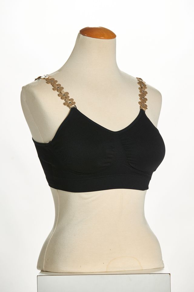 Front image of strap its bra with gold flowers. 