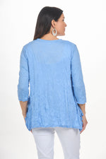 Back image of Shana light blue scoop neck crinkle top. 