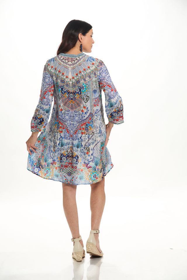Back image of La Moda long sleeve dress in blue pattern. 