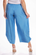 Back image of Shana crushed lantern pant. Blue pull on pants with pockets. 