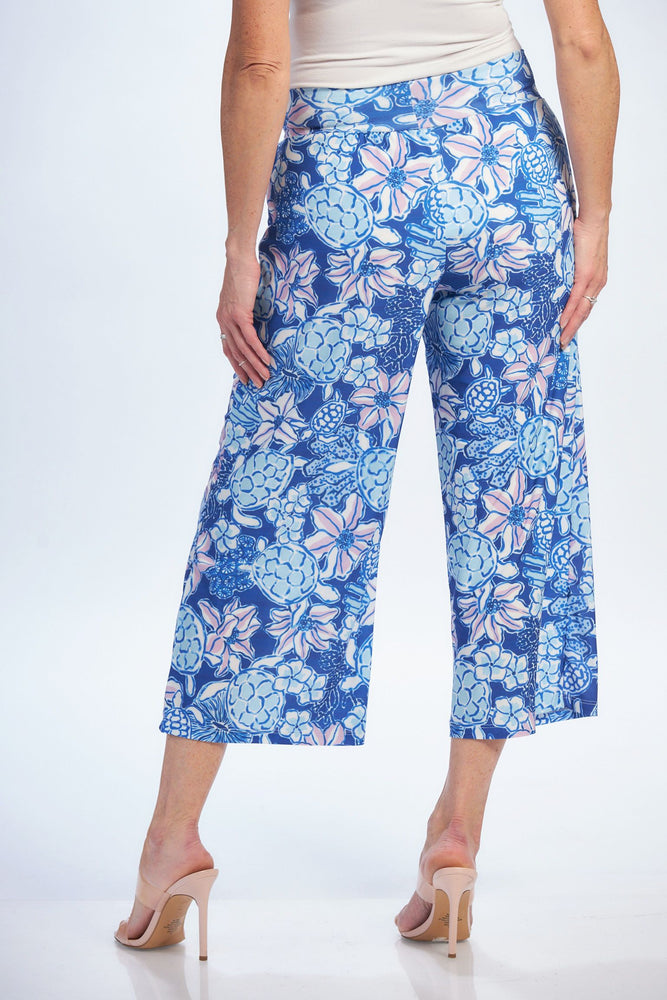 Back image of pull on gaucho pants. Blue turtle printed pants. 