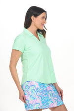 Side image of Lulu B clear lime short sleeve collar top. 