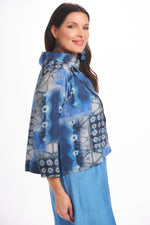 Side image of Shana short printed crushed jacket. 3/4 sleeve blue printed top. 