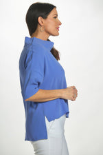 Side image of Suzy D London cowl neck top. Jean blue solid cowl neck. 