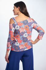 Back image of one shoulder top in daisy print. 