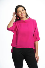 Front image of suzy d london cowl neck top. Hot pink sweater top. 