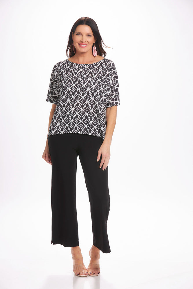 Front image of Mimozza Dolman sleeve relaxed top. Black and white feather printed top. 
