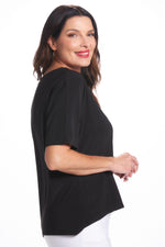 Side image of Black mimozza short sleeve dolman sleeve top. 
