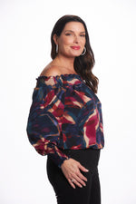 Side image of Last Tango navy multi off the shoulder top. Date night out top. 
