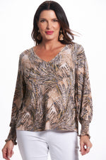 Front image of last tango neutral printed elastic cuff top. 