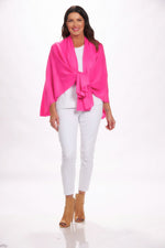 Front image of magic scarf loop and pull through wrap. Hot pink cardigan. 