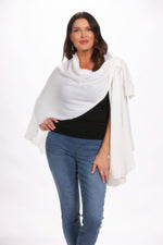 Front image of off white loop pull through wrap. White open front cardigan. 