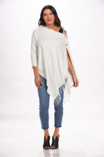 Front image of ivory 2 button cashmere wrap. Button and fringe top. 