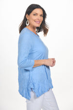Side image of Shana light blue scoop neck crinkle top. 