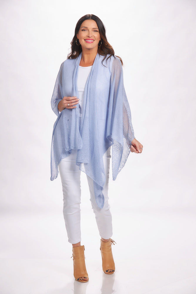 Front image of the magic scarf top. Lightweight knit ruana in light blue. 