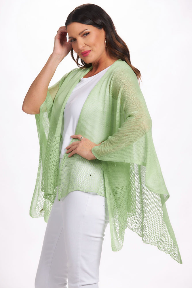 Side image of the magic scarf lightweight knit ruana. Mint green shawl. 