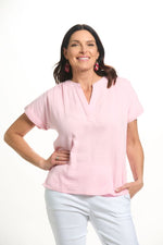 Front image of Lulu B short sleeve gauze top in clear pink. 