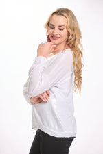 Side image of made in italy white shimmer long sleeve top. 