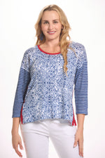 Front image of cubism mixed print sweater. Blue and red printed scoop neck top. 