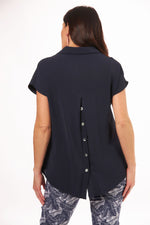 Back image of Cap Sleeve Collar button back top. Navy solid top. 