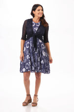 Front image of Shana crinkle dress. Navy printed dress with front seam. 