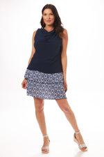 Front image of pull on ruffle skort. Navy pattern skort with ruffle detail. 