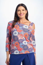 Front image of one shoulder top in daisy print. 