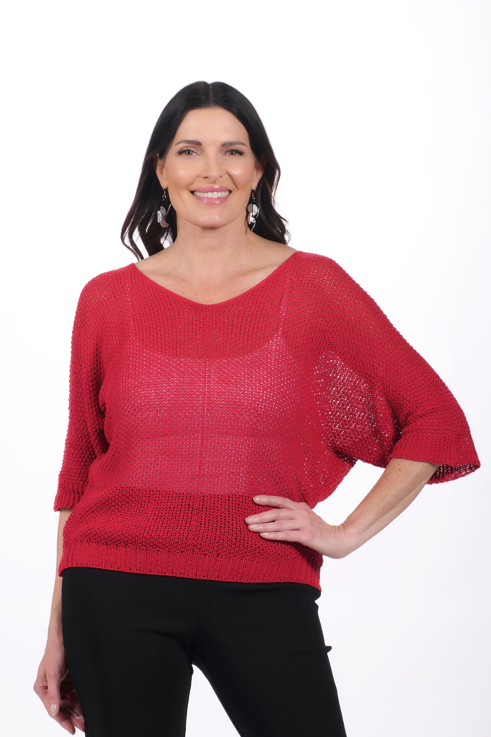 Front image of red v-neck open knit sweater.