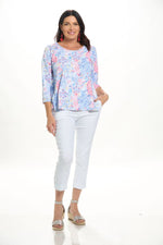 Front image of Cubism parachute hem top in multi print. 