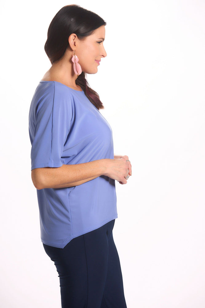 Side image of Mimozza dolman sleeve relaxed top. Short sleeve periwinkle top. 